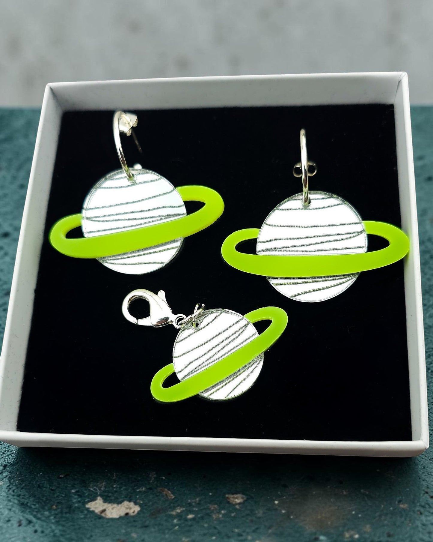 Morti's Fun Club Solar System twinning set with green and silver acrylic planet earrings and matching collar charm.
