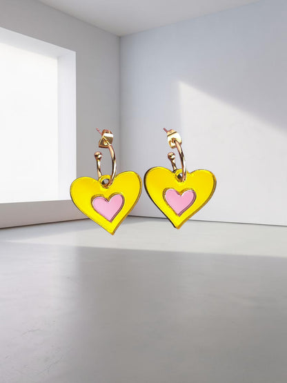 Morti's Fun Club Candy Canary heart earrings in yellow and pink mirrored acrylic with gold-plated hoops.