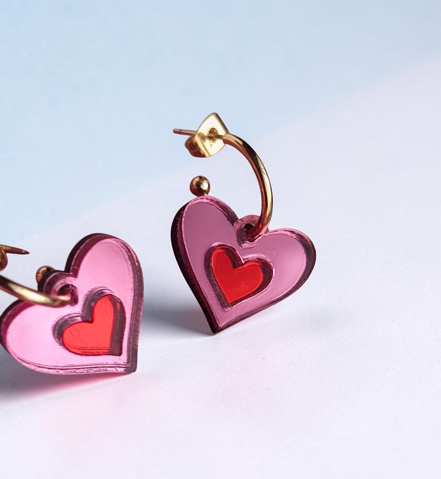Morti's Fun Club Cherry Blossom heart earrings in pink and red mirrored acrylic with gold-plated hoops.