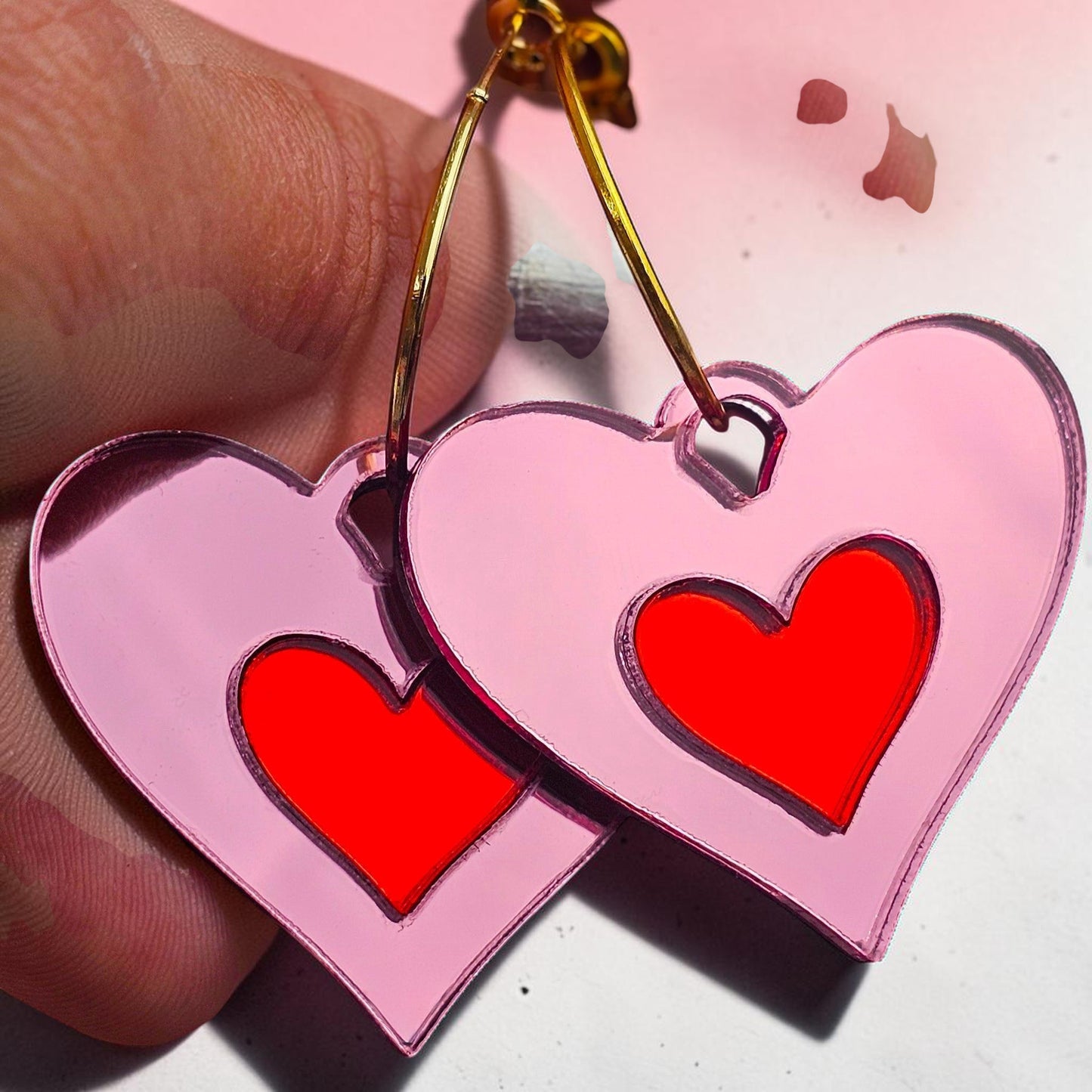 Morti's Fun Club Cherry Blossom heart earrings with pink acrylic and red inlaid centres on silver-plated hoops.