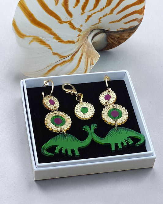 Morti's Fun Club Dino Royalty twinning set with green dinosaur earrings and matching dog collar charm in a gift box.