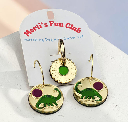 Morti's Fun Club Tiny Dino Twinning Set featuring gold-mirrored acrylic earrings and a matching dog collar charm.