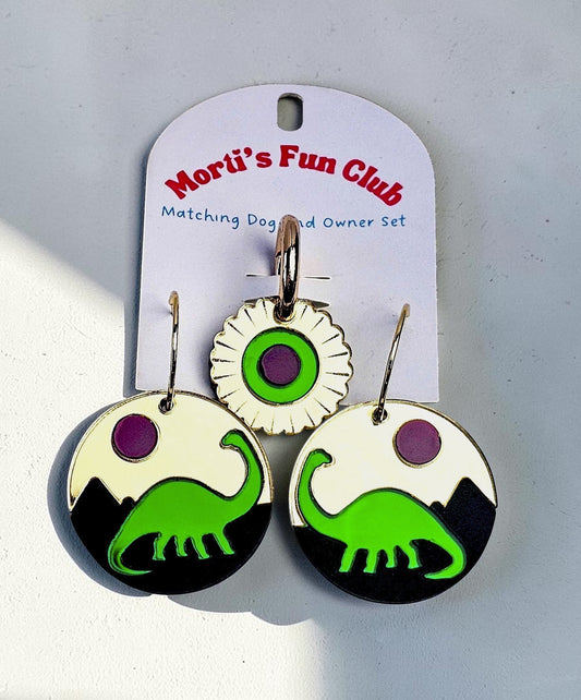 Morti's Fun Club Jurassic Moonrise twinning set with green dinosaur earrings and matching floral pet collar charm.