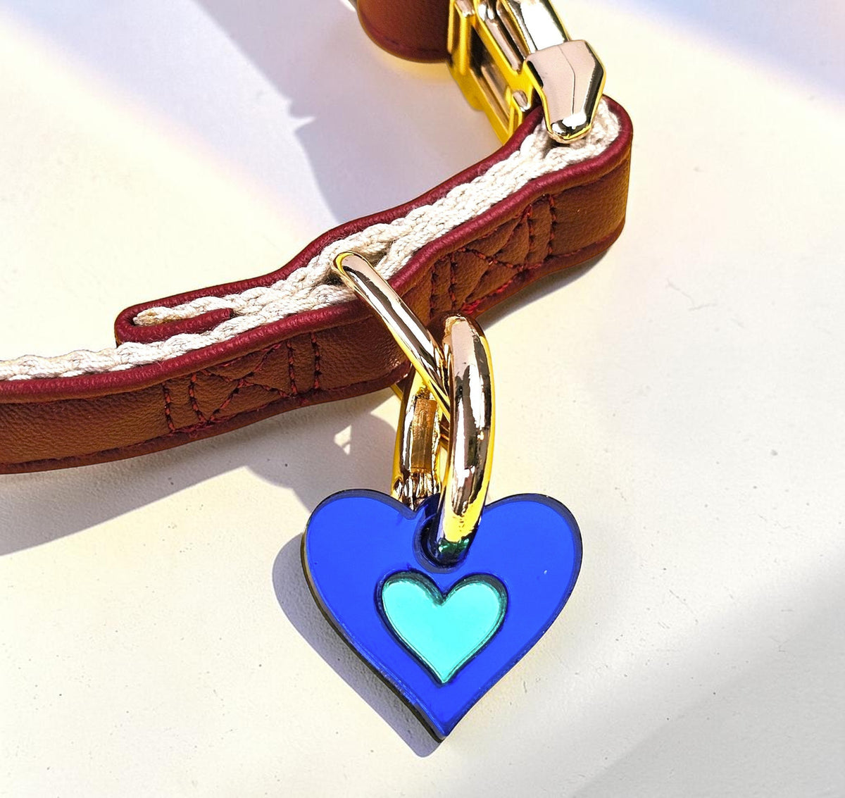 Morti's Fun Club Sea Creature heart collar charm in royal blue and green acrylic hanging from a silver-plated clip