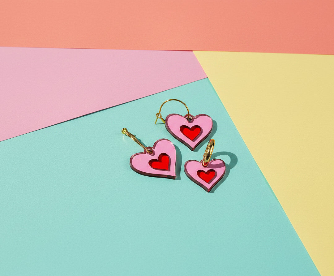 Morti's Fun Club matching pink and red heart jewelry set for pets and owners with silver-plated hoops and charms.