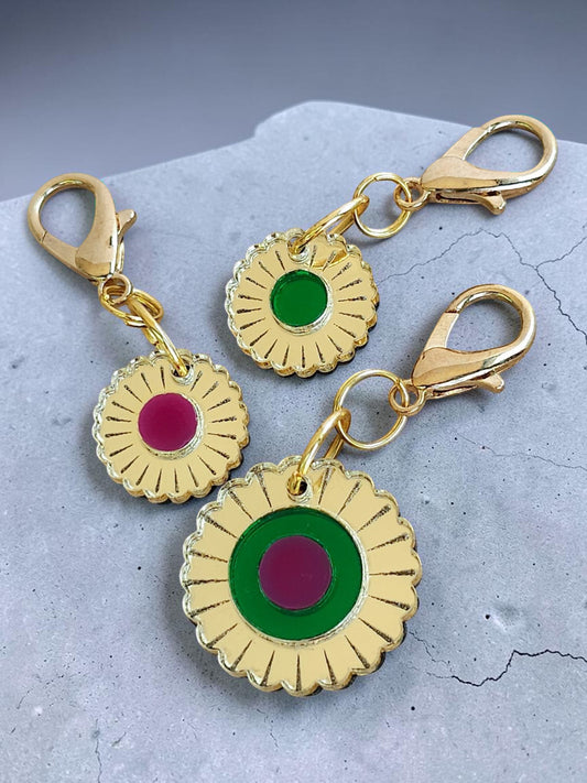 Morti's Fun Club Jurassic Bloom mirror acrylic flower charm with gold lobster clasp and green or purple centres.