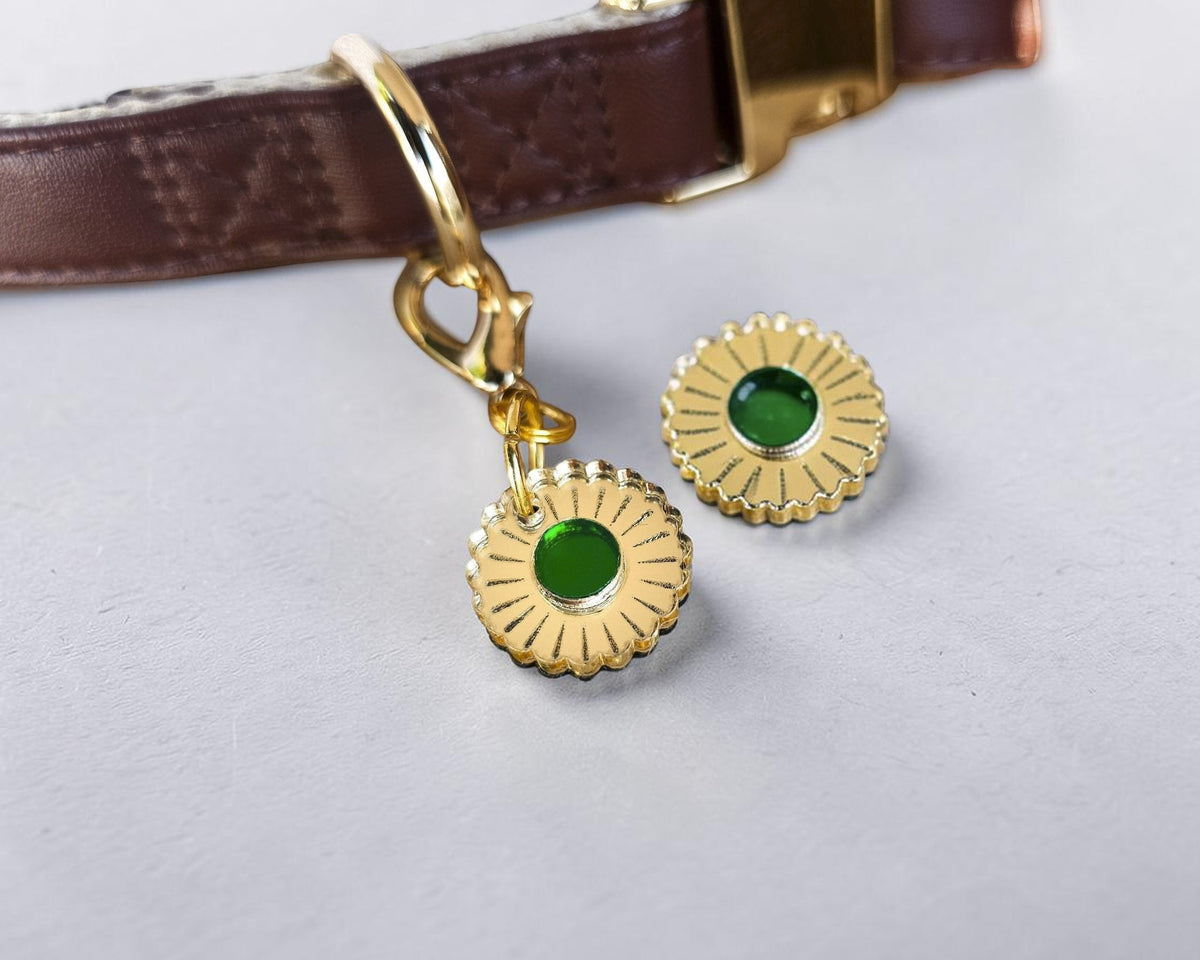 Morti's Fun Club Jurassic Bloom collar charm featuring a gold mirror acrylic flower design with a vibrant green center.