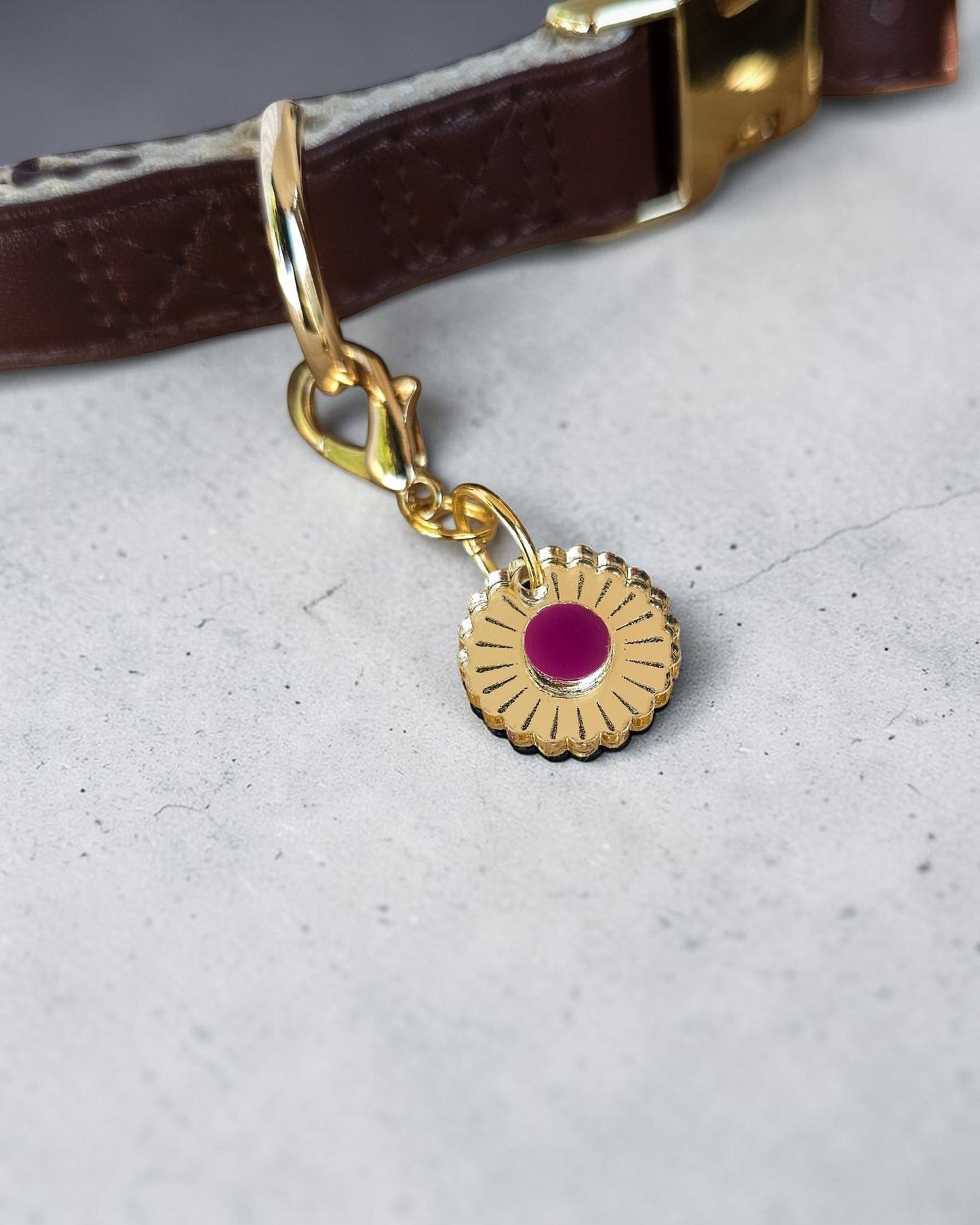 Morti's Fun Club Jurassic Bloom collar charm featuring a gold mirror acrylic flower with a vibrant purple centre.
