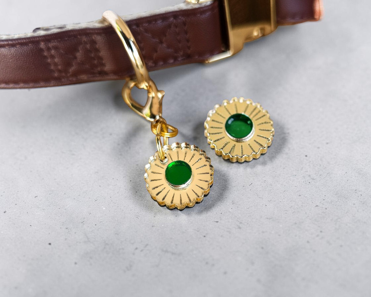 Morti's Fun Club Jurassic Bloom collar charm featuring a gold mirror acrylic flower design with a vibrant green center.