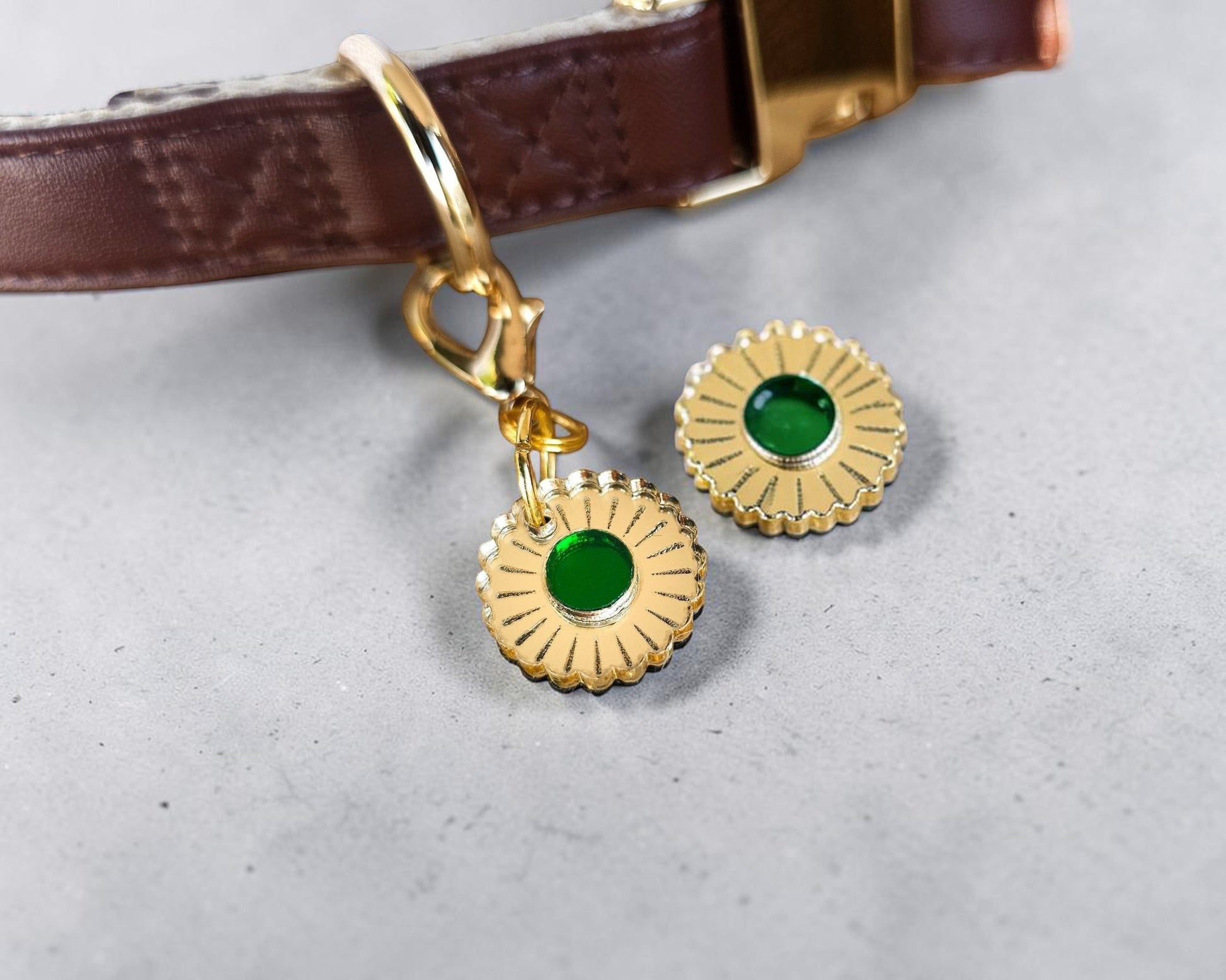 Morti's Fun Club Jurassic Bloom collar charm featuring a gold mirror acrylic flower design with a vibrant green center.