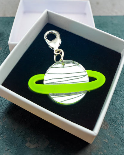 Morti's Fun Club Spacehopper Silver Saturn collar charm with a mirror silver acrylic body and lime fluoro ring.