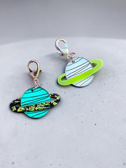 Morti's Fun Club Saturn collar charms in Galaxylicious Green and Spacehopper Silver acrylic with lobster clasps.