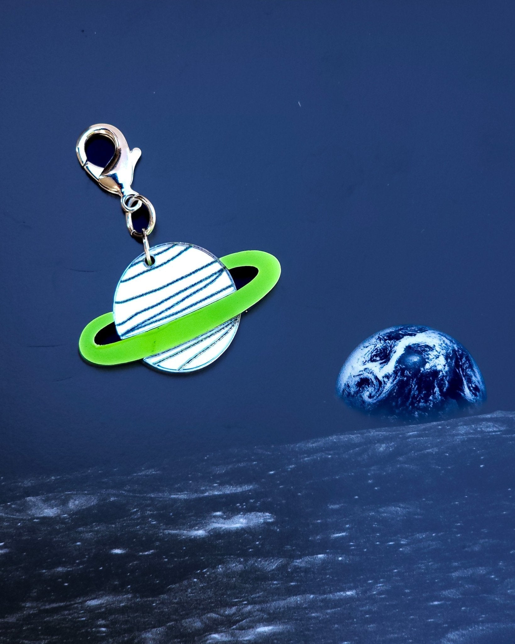 Morti's Fun Club Galaxylicious Green Saturn dog collar charm made of mirrored acrylic with a lime green glitter ring.