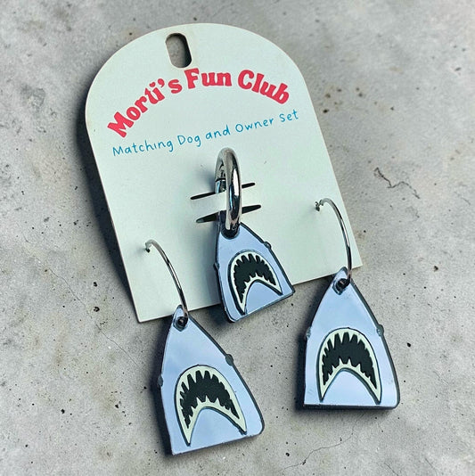 Morti's Fun Club Bite Me shark twinning set featuring mirrored silver acrylic earrings and a matching dog collar charm