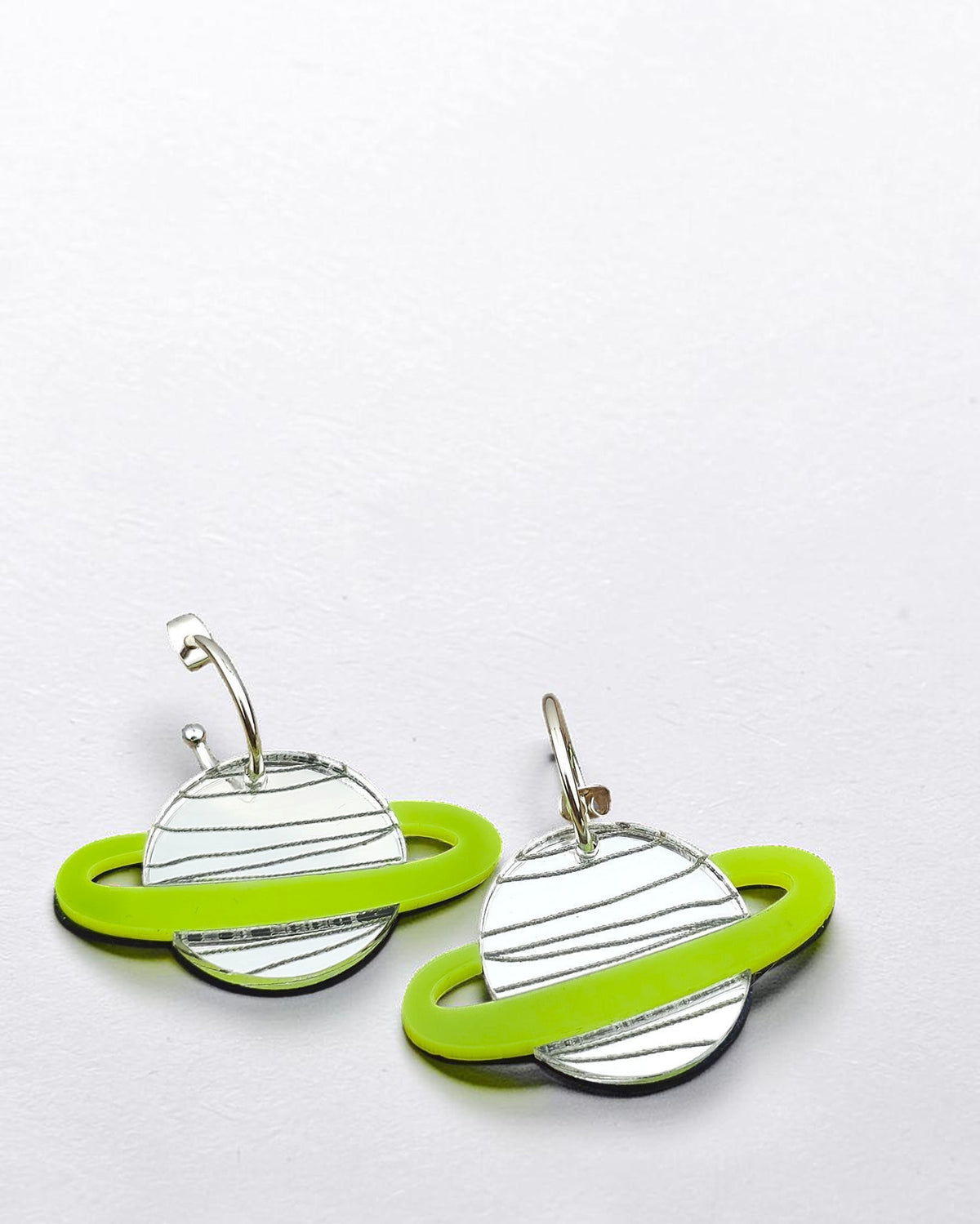 Morti's Fun Club Spacehopper Silver planet earrings with mirror silver bodies and lime green rings on gold hoops
