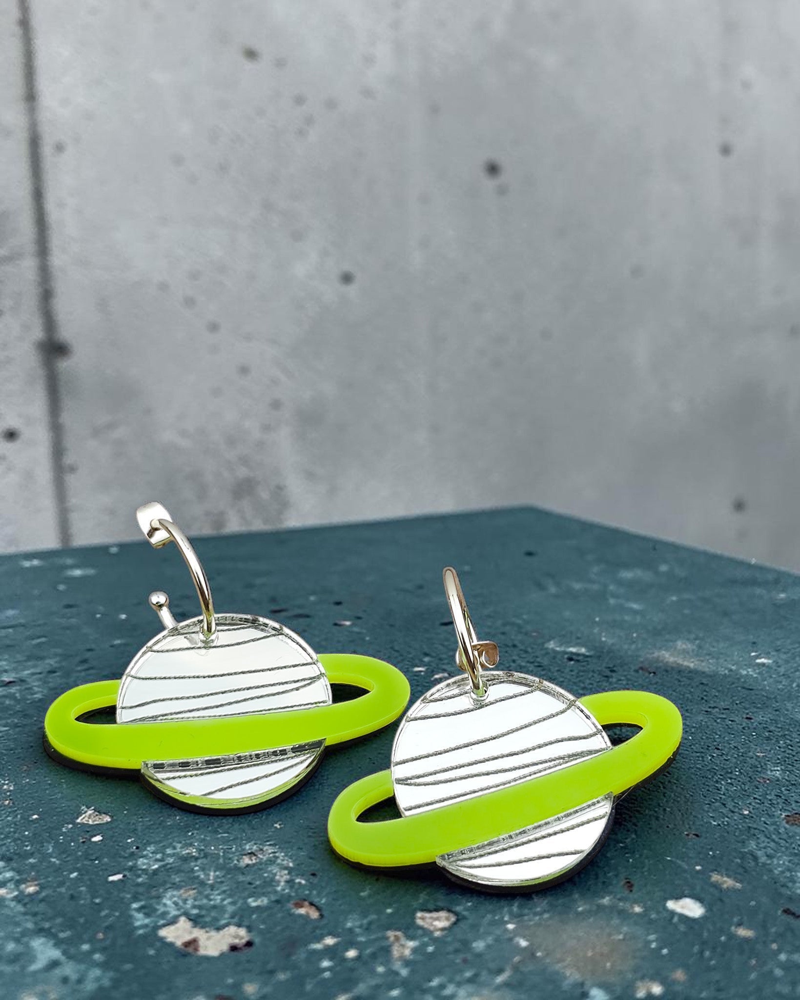 Morti's Fun Club Spacehopper Silver planet earrings with mirror silver bodies and lime green rings on gold hoops