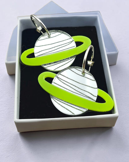 Morti's Fun Club Spacehopper Silver planet earrings with mirror silver acrylic and lime fluro rings in a gift box.