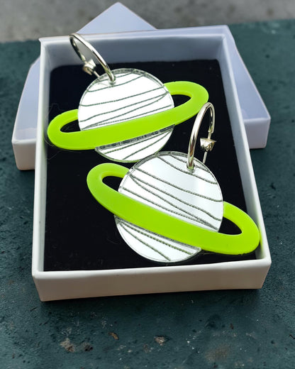 Morti's Fun Club Spacehopper Silver planet earrings with mirror silver acrylic and lime fluro rings in a gift box.
