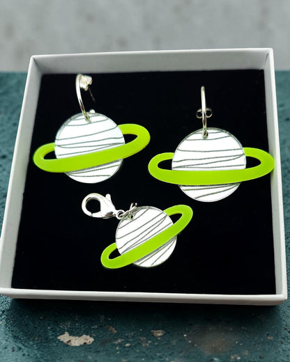 Morti's Fun Club Solar System twinning set with green and silver acrylic planet earrings and matching collar charm.