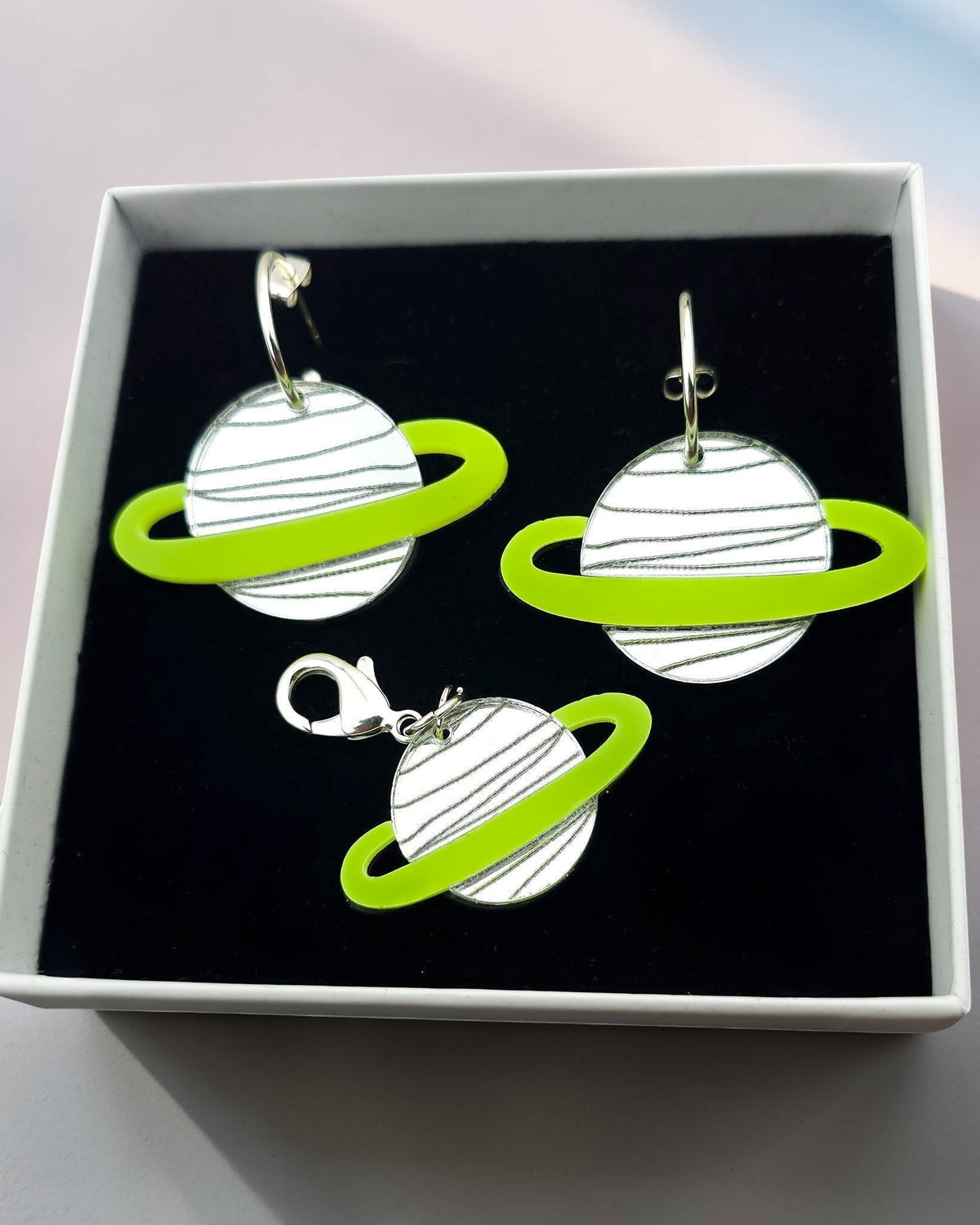 Morti's Fun Club Solar System twinning set with green and silver acrylic planet earrings and matching collar charm.
