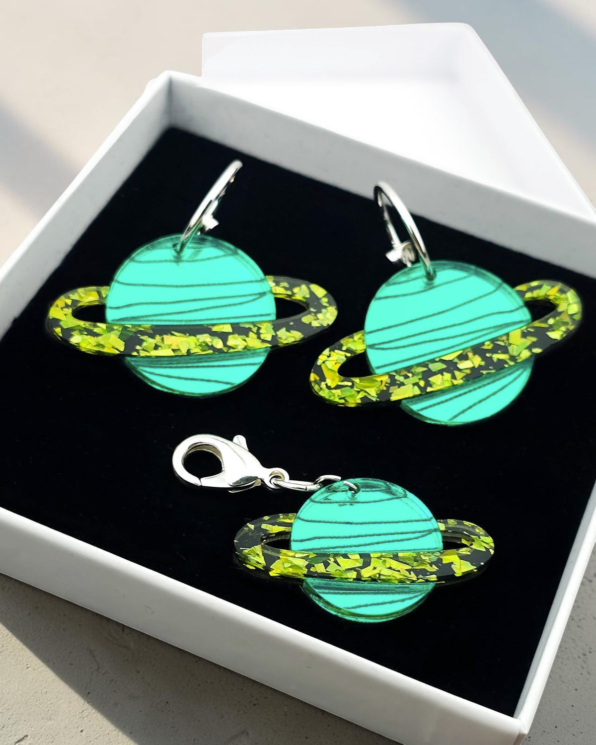 Morti's Fun Club Solar System twinning set with green acrylic planet earrings and matching collar charm in gift box.