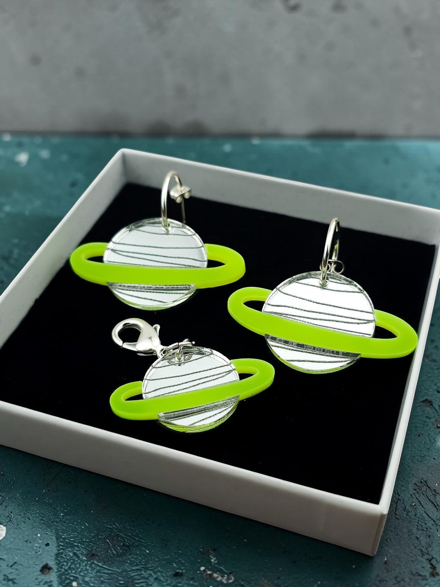 Morti's Fun Club Solar System earrings and collar charm set in Spacehopper Silver with lime fluro rings in a gift box.