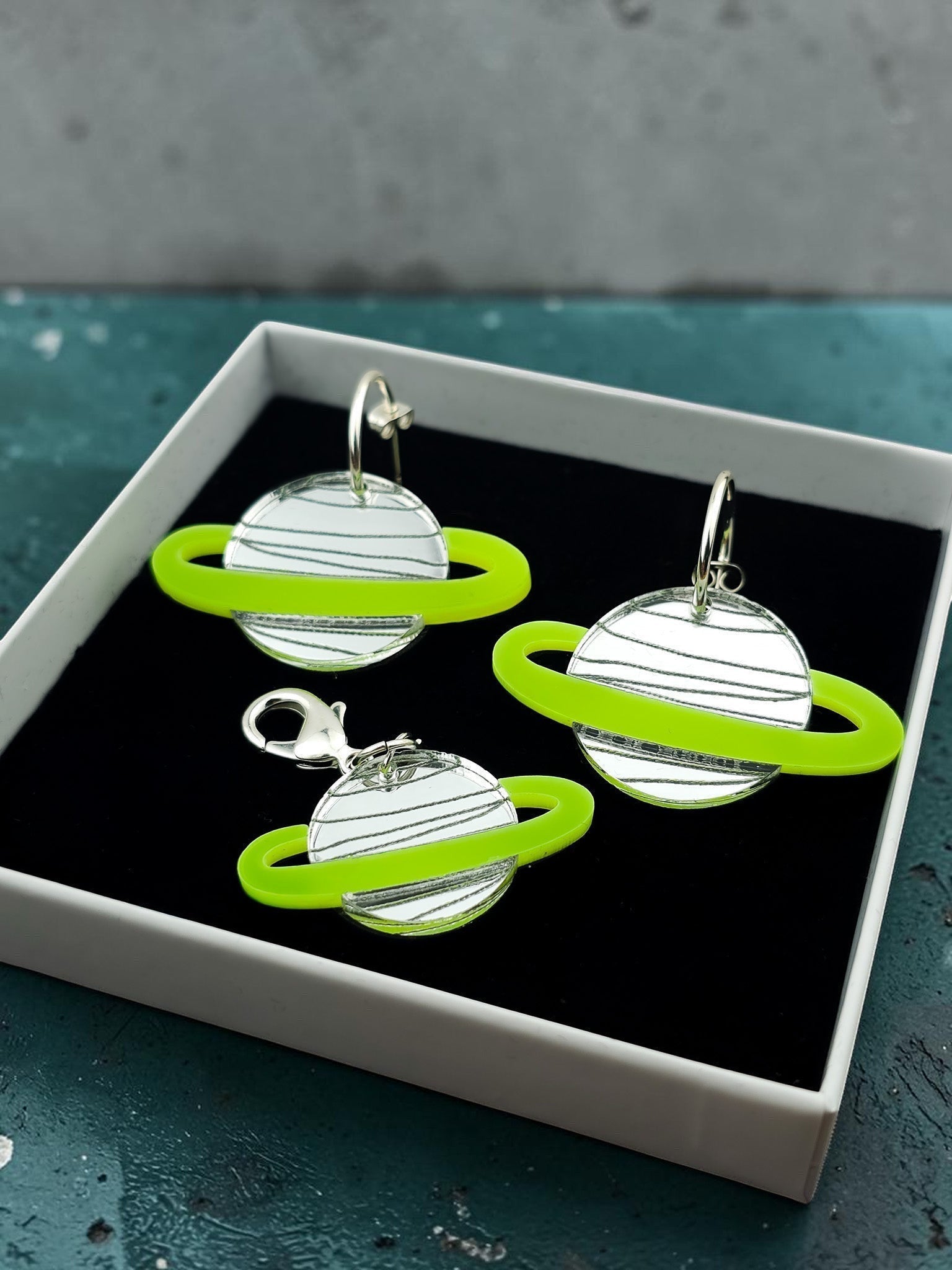 Morti's Fun Club Solar System earrings and collar charm set in Spacehopper Silver with lime fluro rings in a gift box.