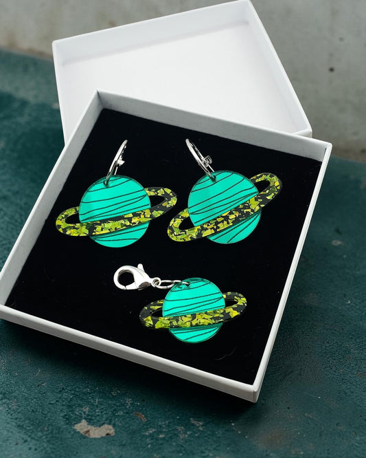 Morti's Fun Club Galaxylicious Green acrylic planet earrings and matching collar charm in a gift box.