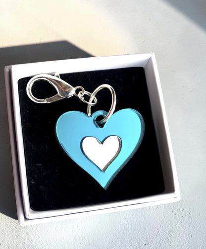 Morti's Fun Club Ice Queen heart dog collar charm in teal and silver acrylic with a lobster clip in a gift box.