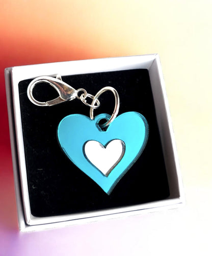 Morti's Fun Club Ice Queen heart collar charm in shimmering teal and silver acrylic with a silver-plated clip.
