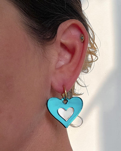 Morti's Fun Club Ice Queen heart-shaped teal and silver acrylic earring on a silver-plated hoop