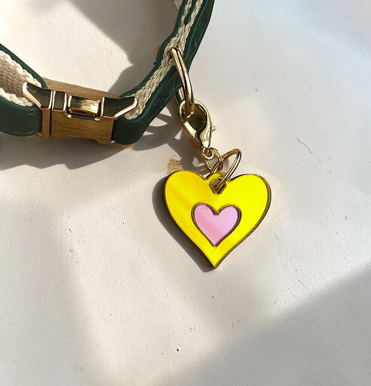 Morti's Fun Club Canary Candy heart collar charm in yellow and pink acrylic with a gold-plated lobster clip.